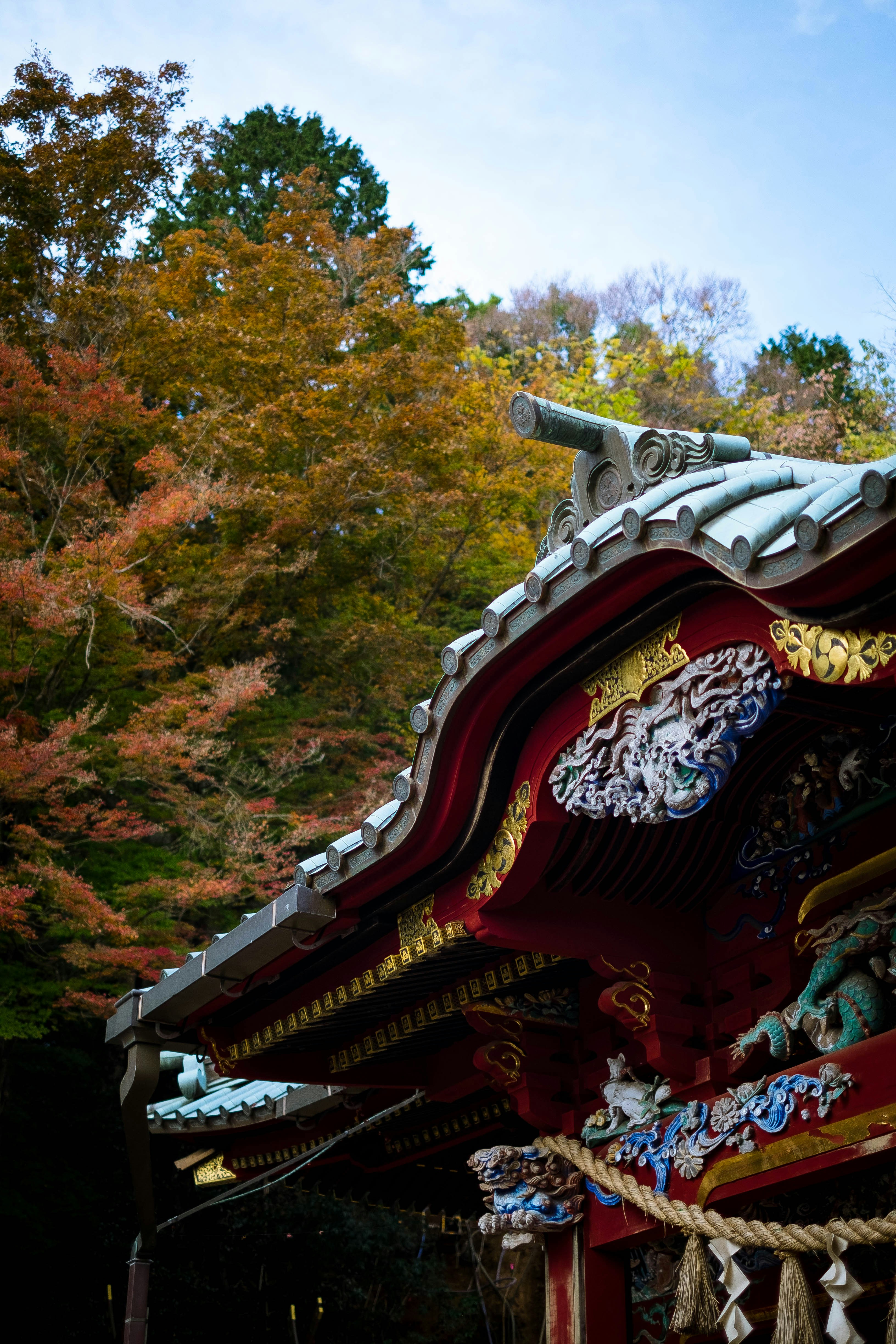 A red and gold building with a clock on top of it