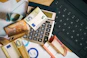 A calculator sitting on top of a pile of money