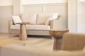 A living room filled with furniture and a fire place