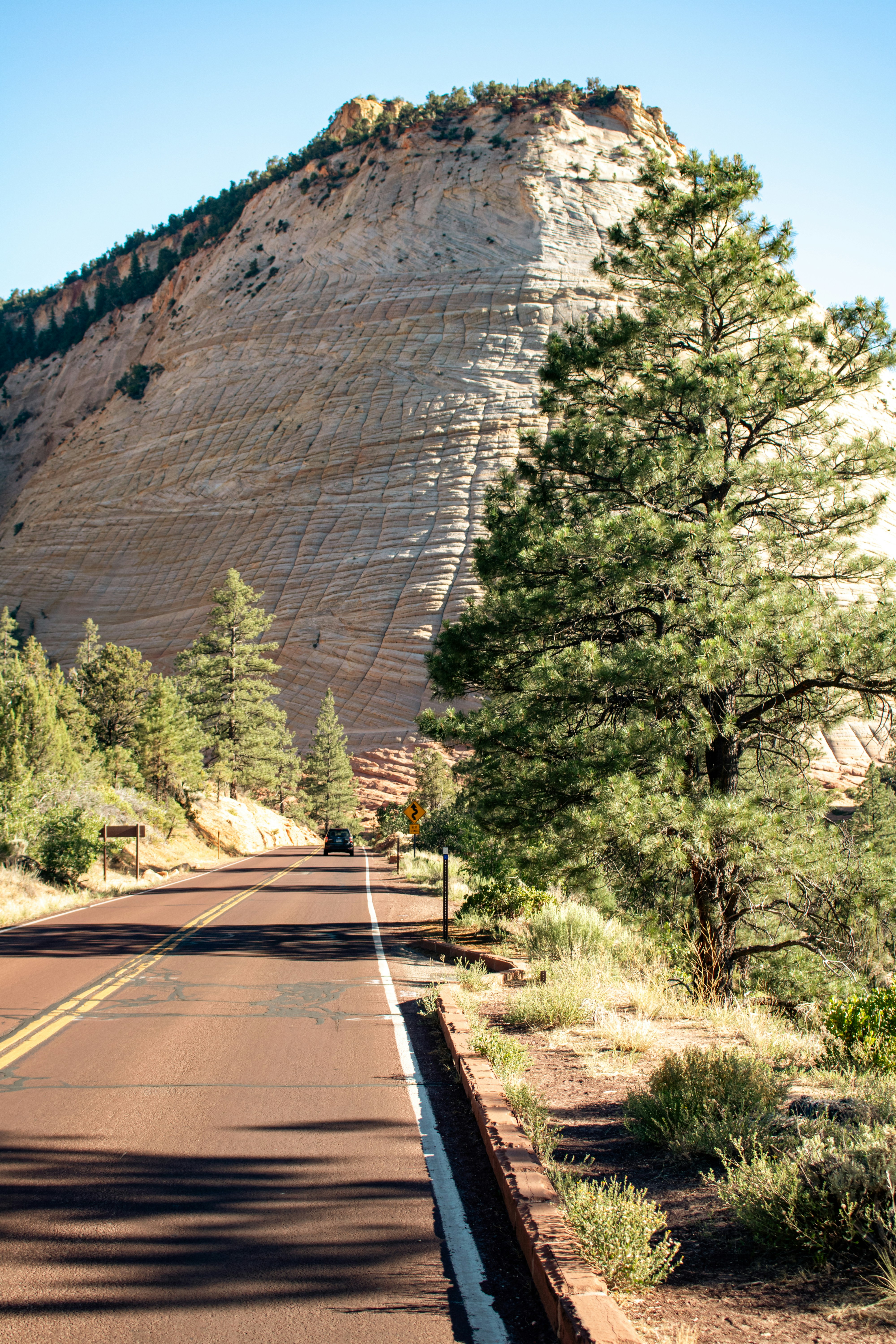 A road with a mountain in the background photo – Free Checkerboard mesa ...