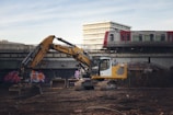 A construction site with a train in the background