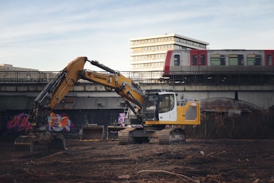 A construction site with a train in the background