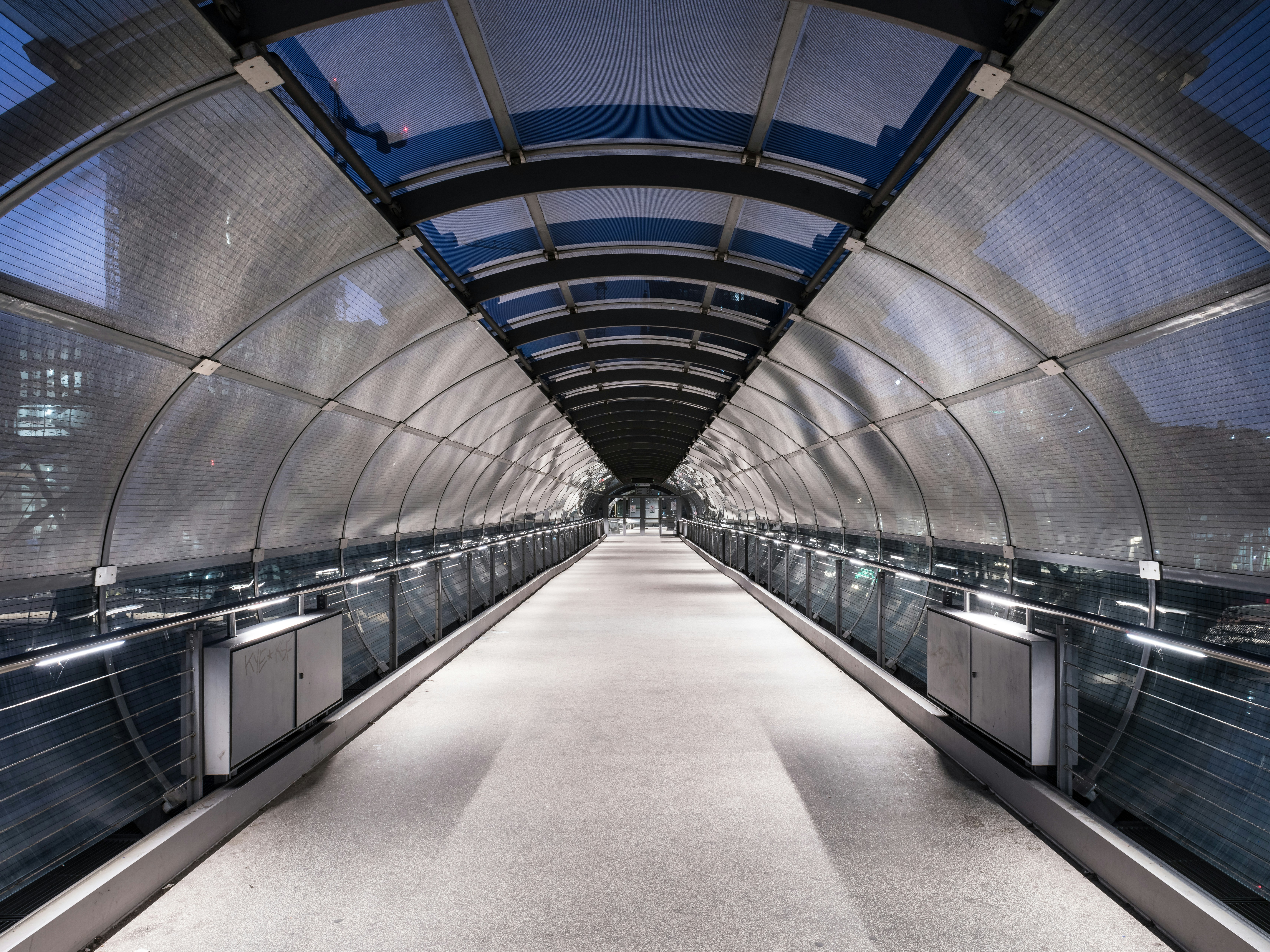 A very long walkway with lots of windows