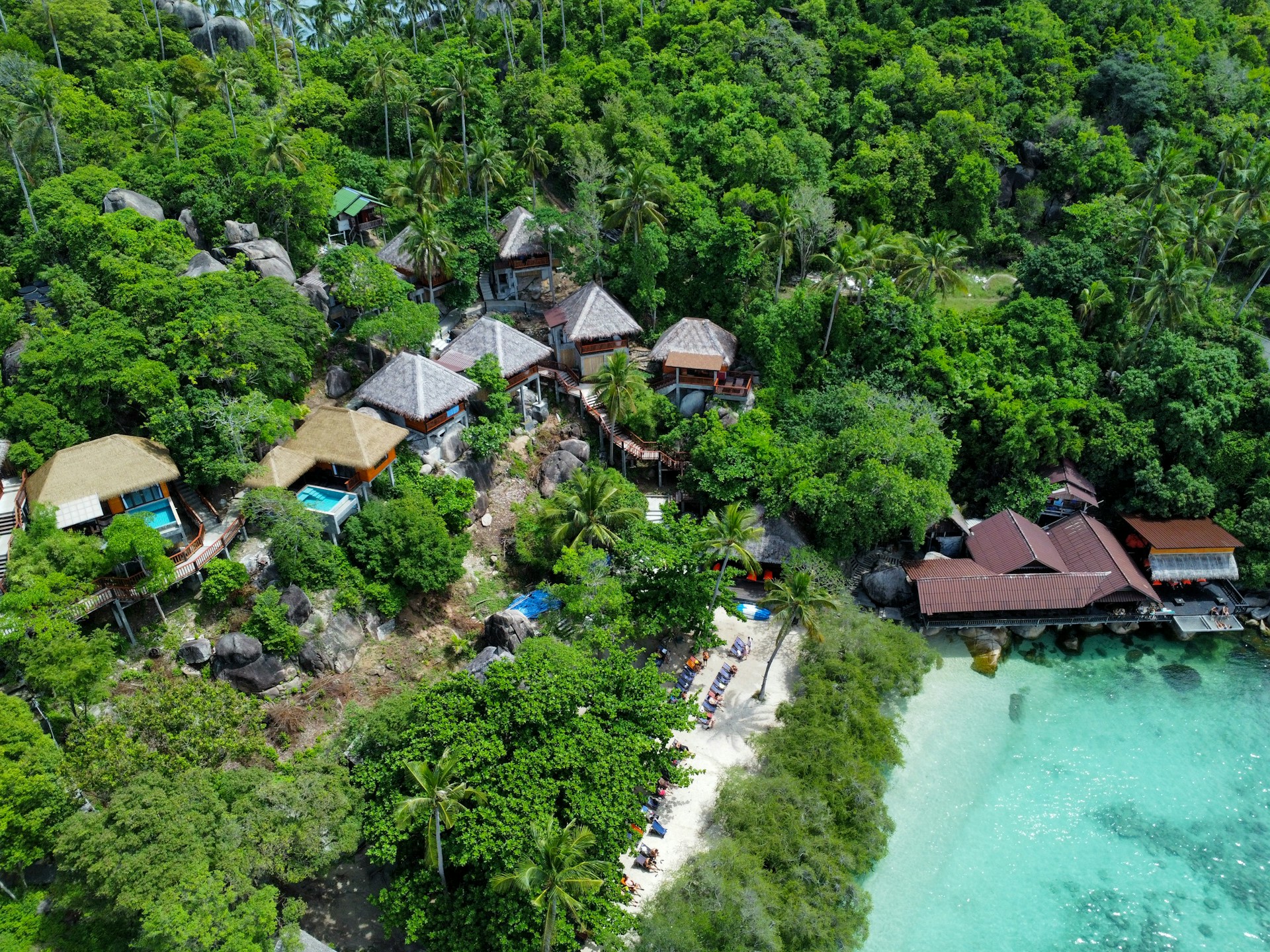 An aerial view of a resort surrounded by trees