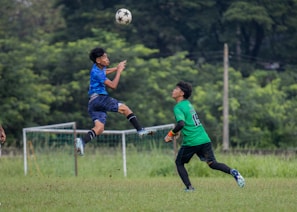 A group of young men playing a game of soccer