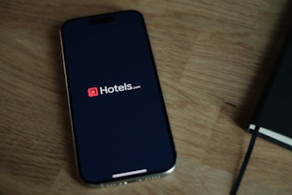 A cell phone sitting on top of a wooden table
