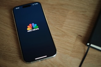 A close up of a cell phone on a table