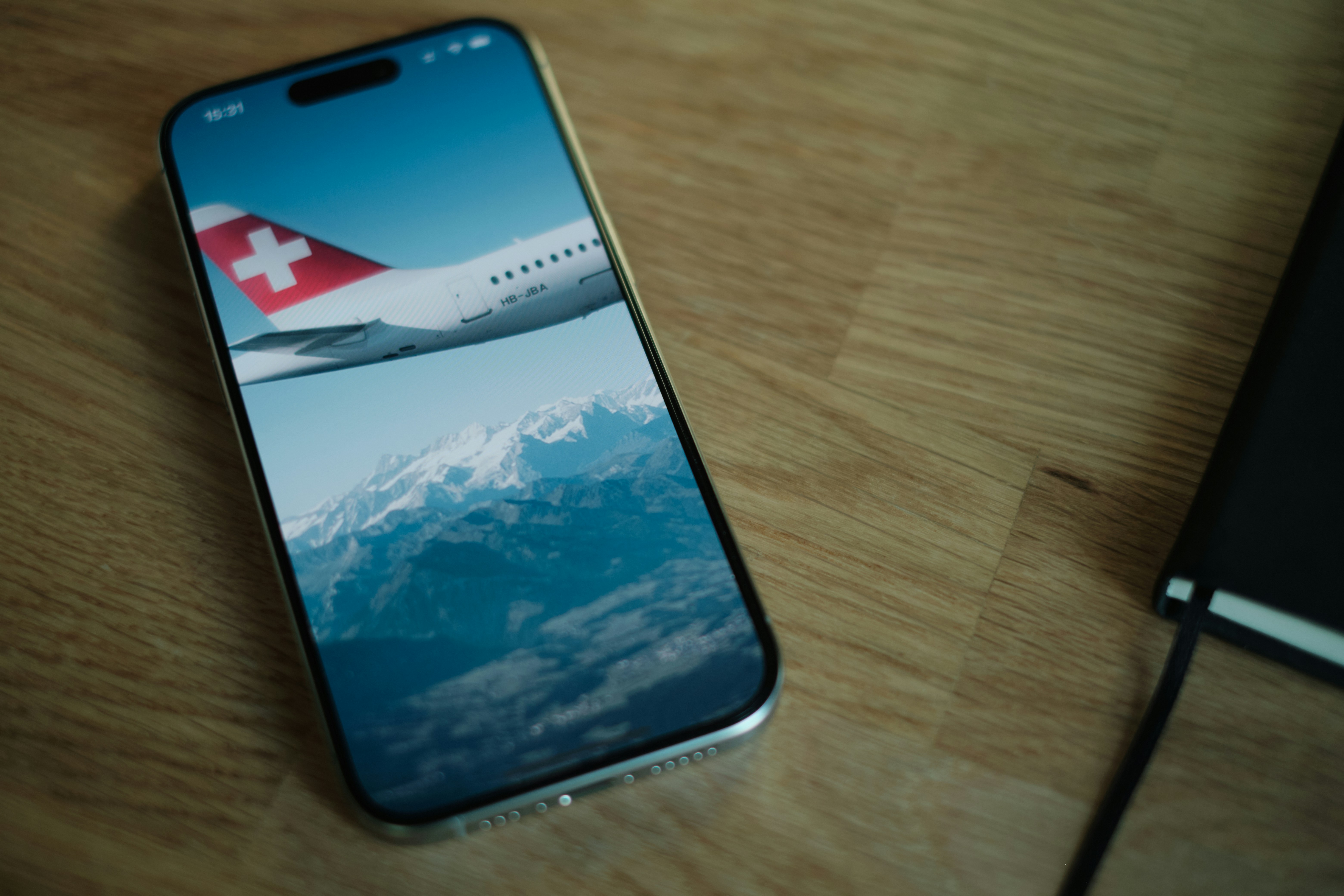A cell phone sitting on top of a wooden table