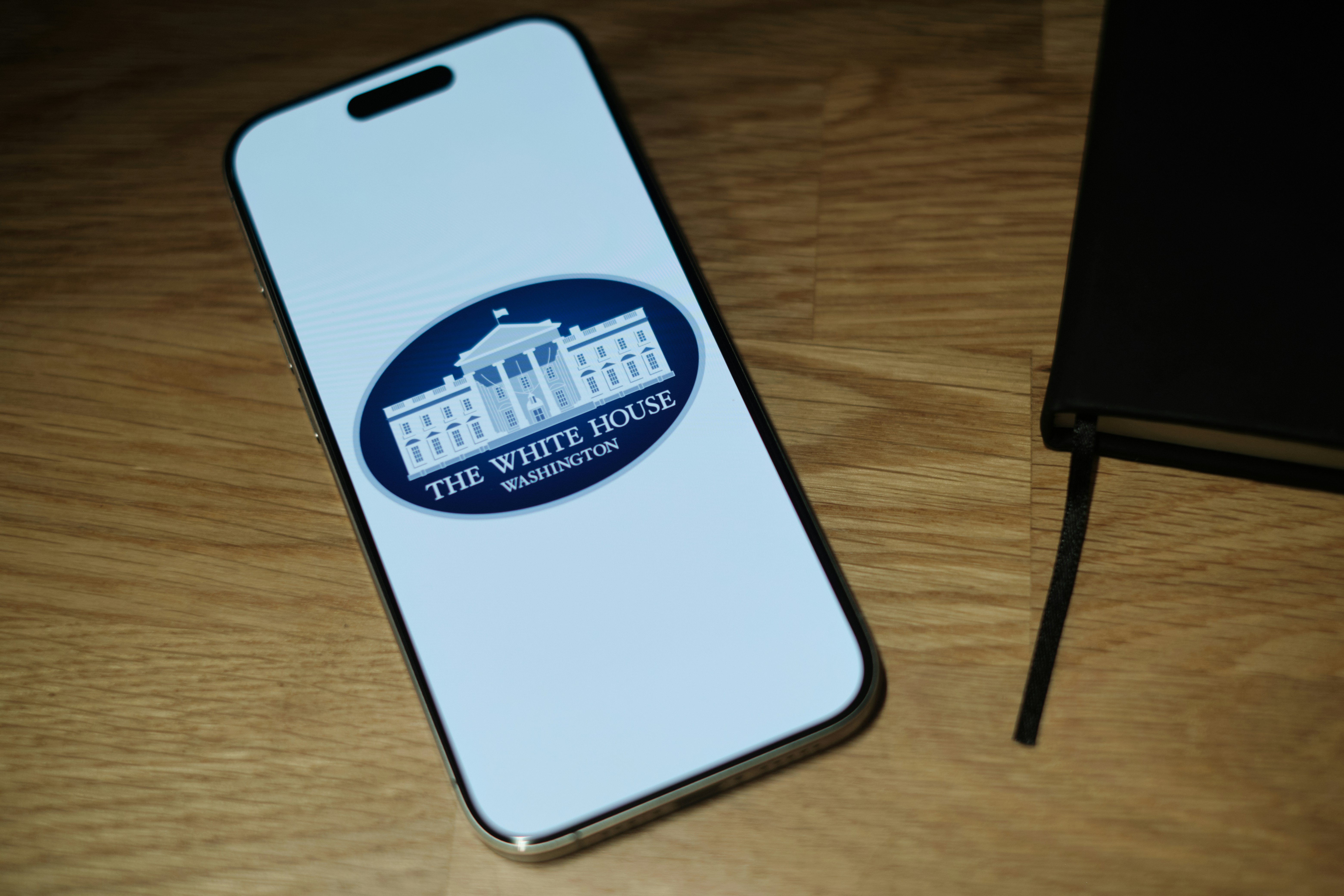 Cell phone on wooden table
