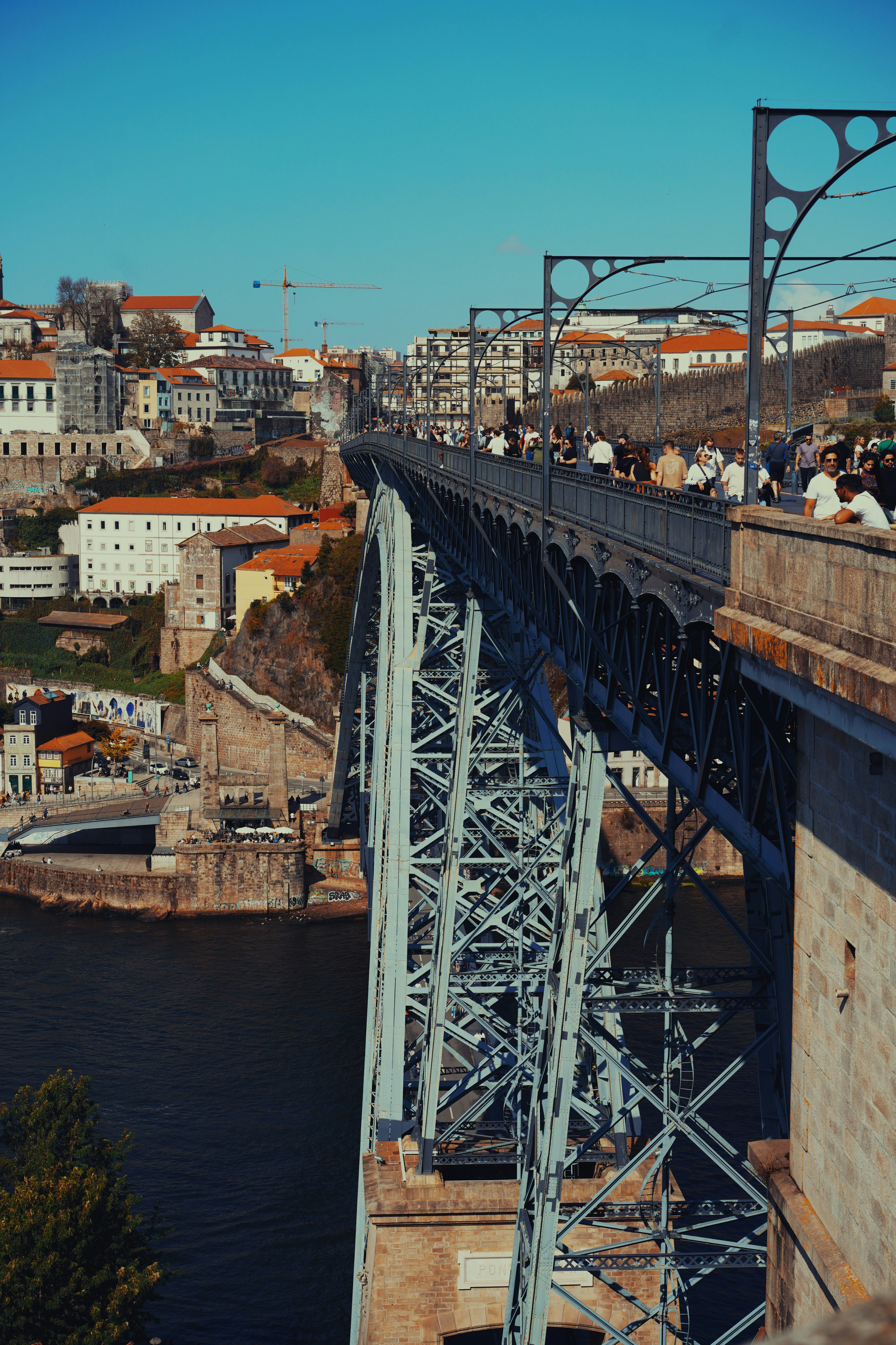 A group of people standing on top of a bridge