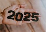 A person's hand holding the number twenty twenty twenty twenty twenty twenty twenty twenty