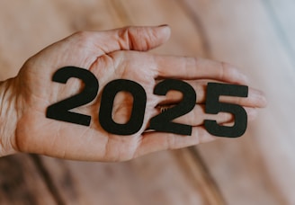 A person's hand holding the number twenty twenty twenty twenty twenty twenty twenty twenty