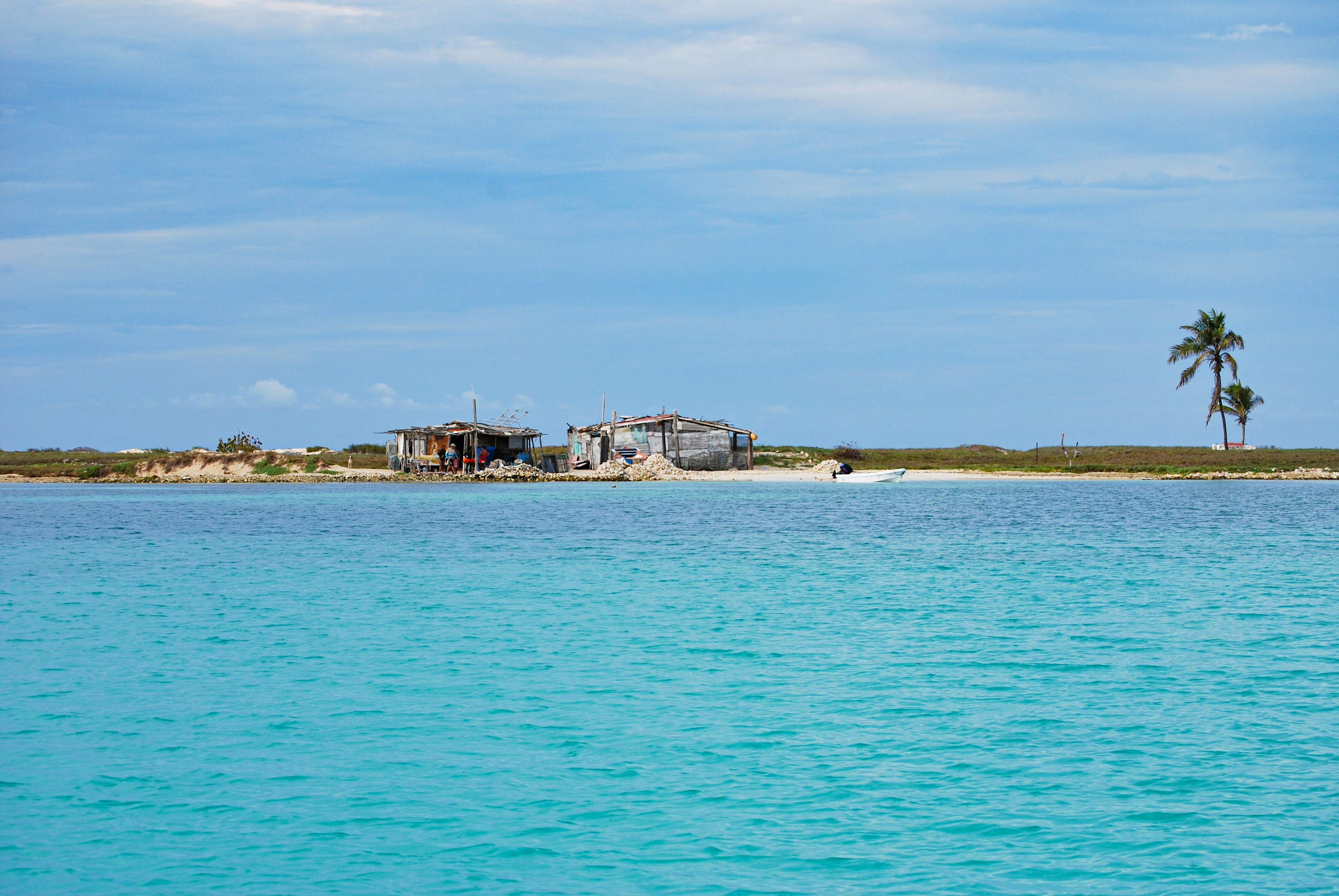 A body of water with a small island in the background