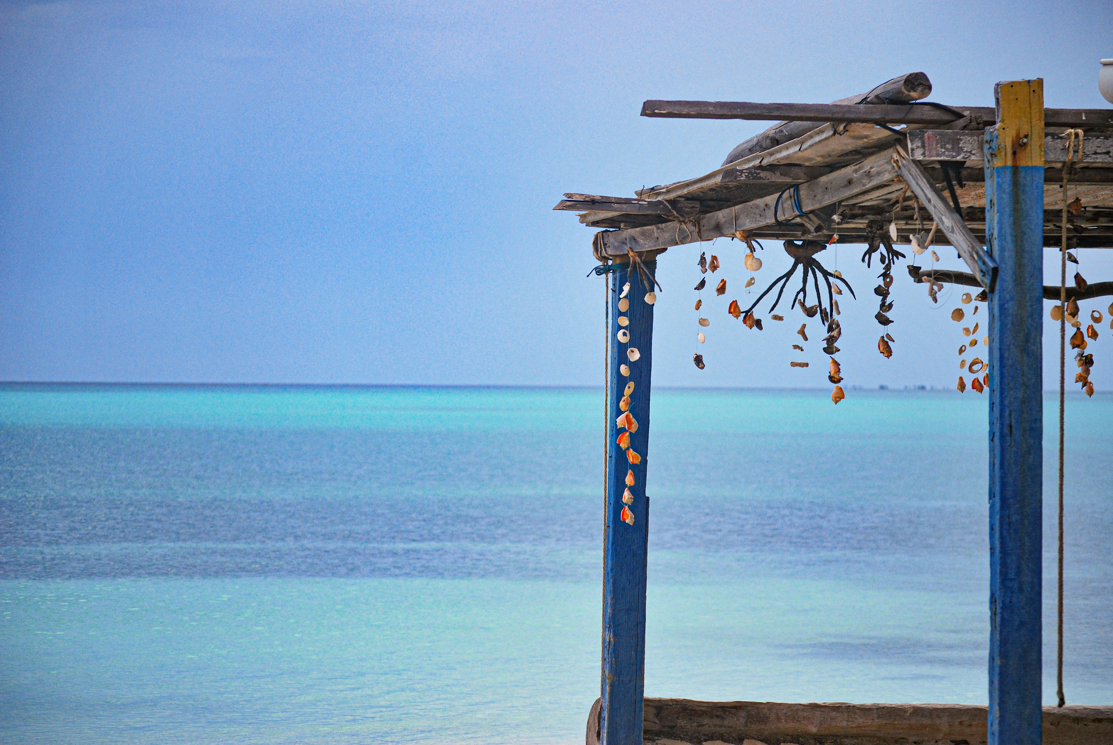 A gazebo on the beach with a view of the ocean