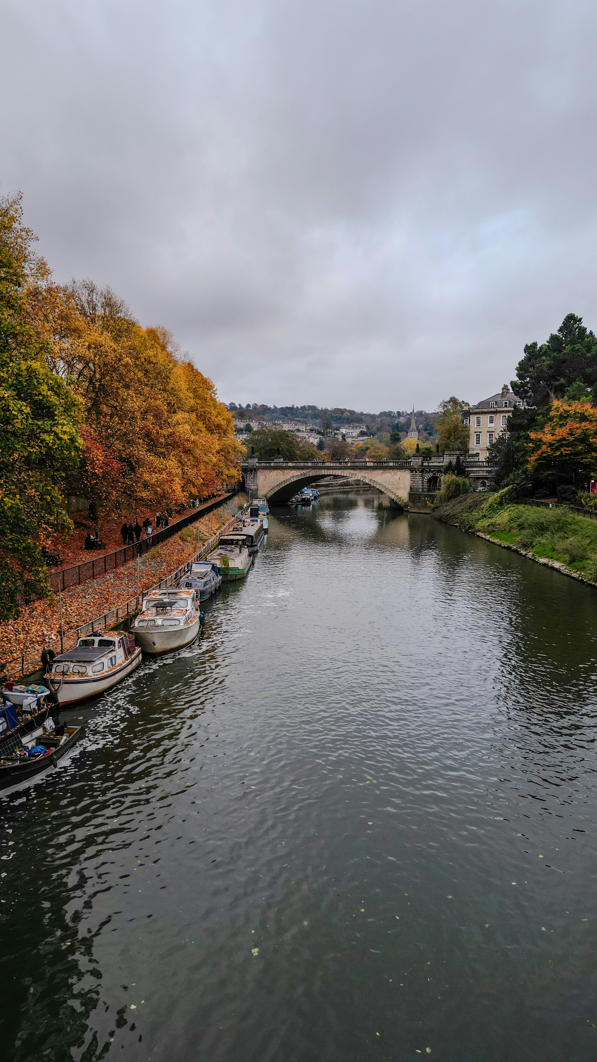 A river running through a city next to a bridge