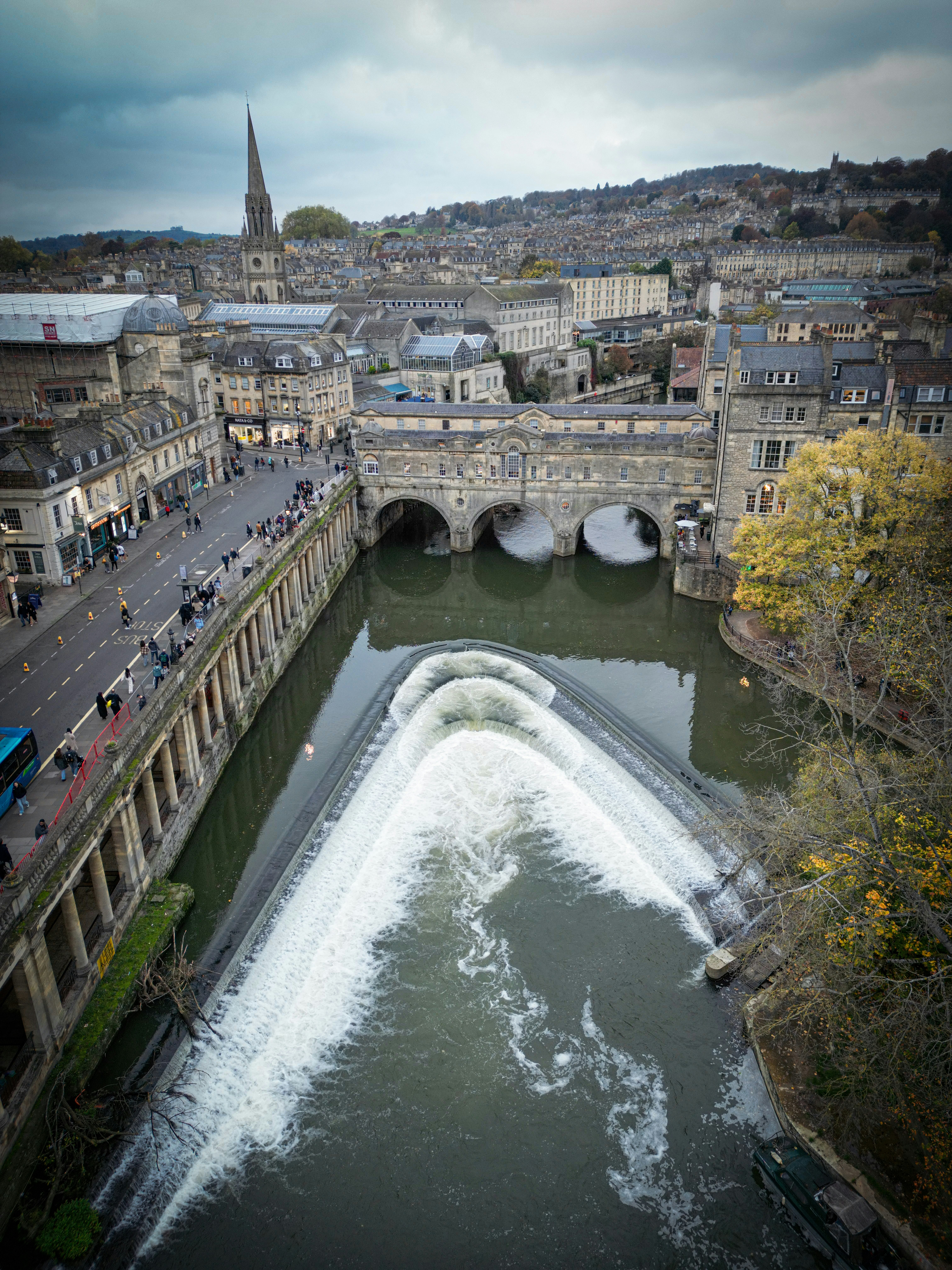 A river running through a city next to a bridge