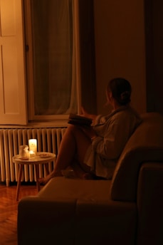 A woman sitting on a couch in a living room