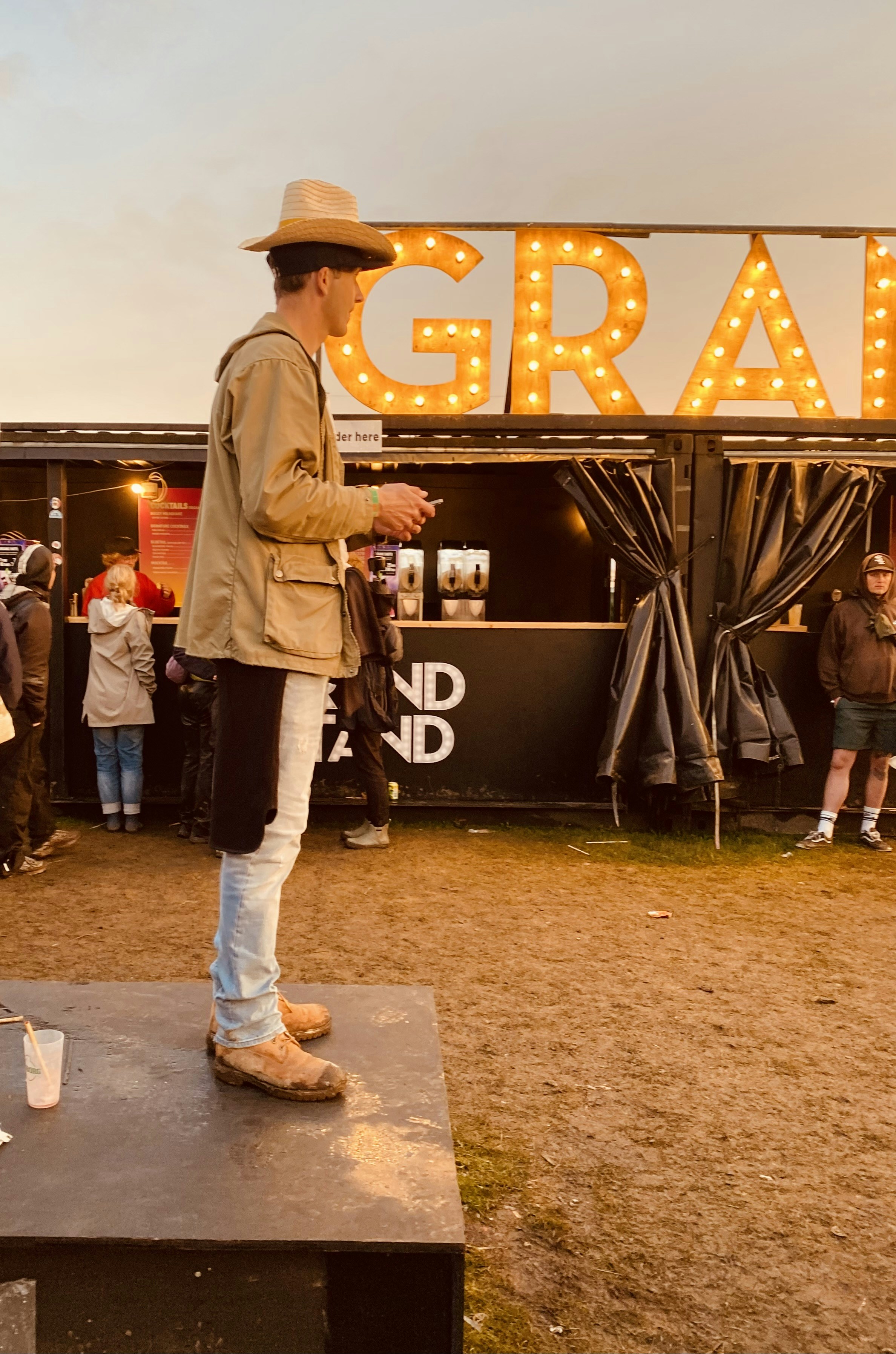 A man standing on top of a wooden platform