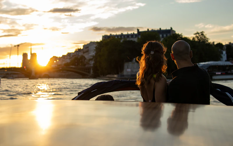 couple watching the sunset from a boat