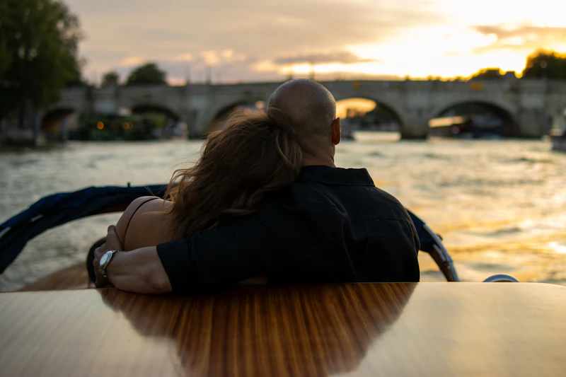 couple sitting close on a boat