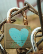 A padlock with a blue heart on it