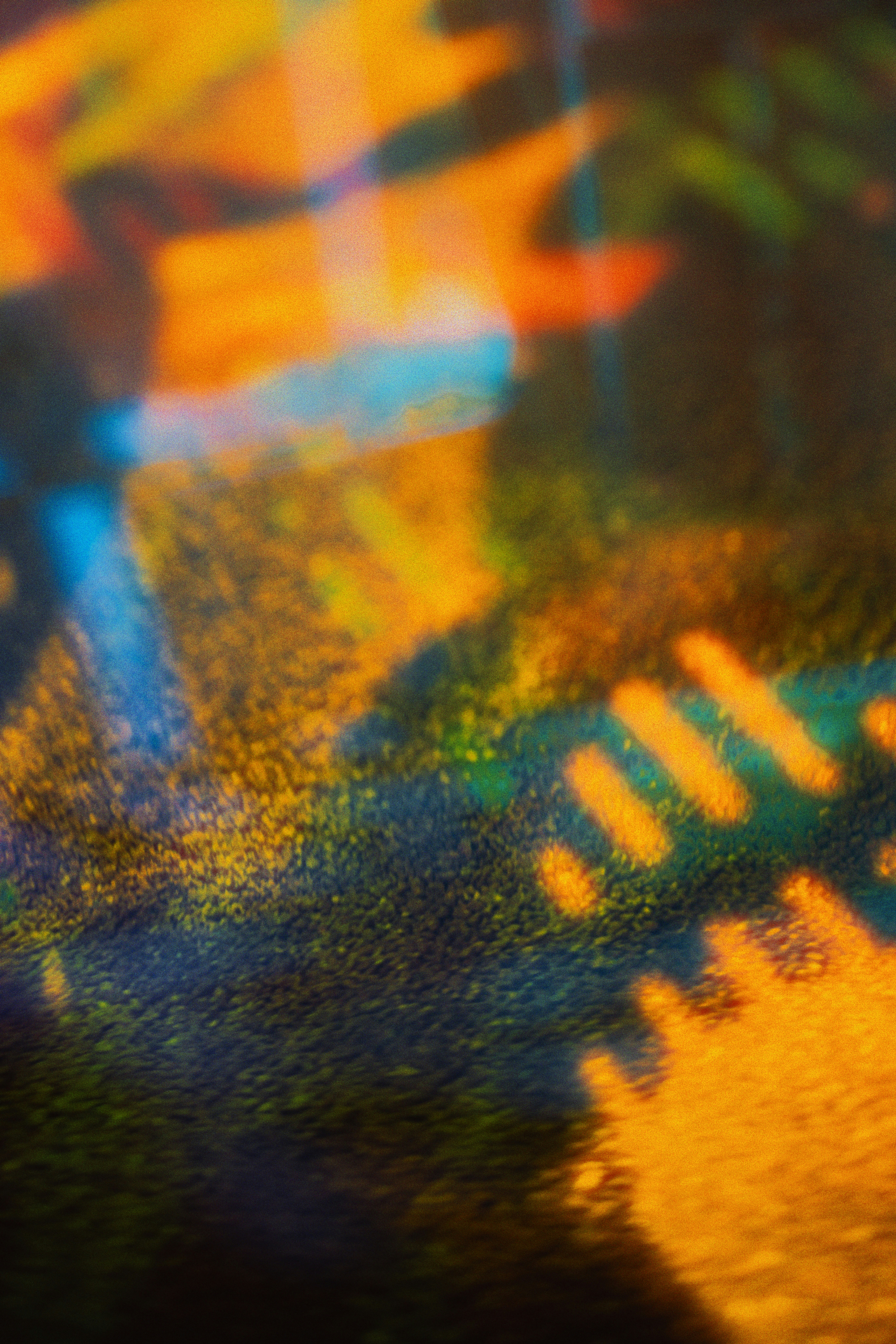 A blurry photograph of a colorful object