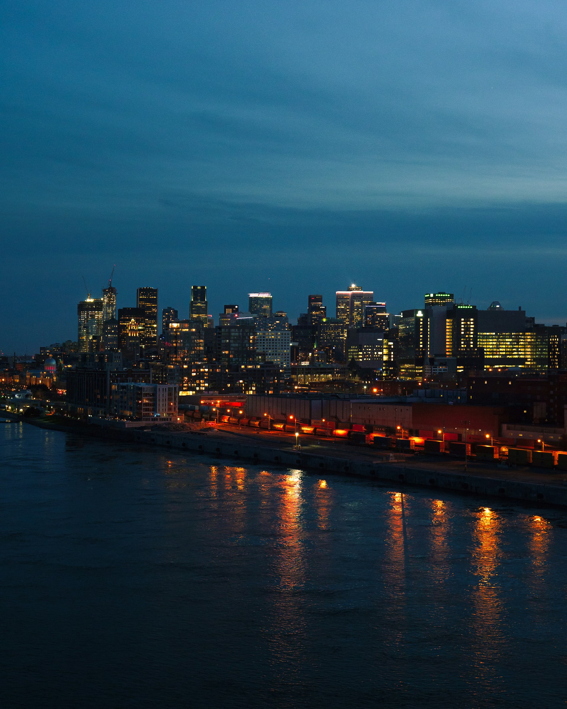 A view of a city at night from across the water