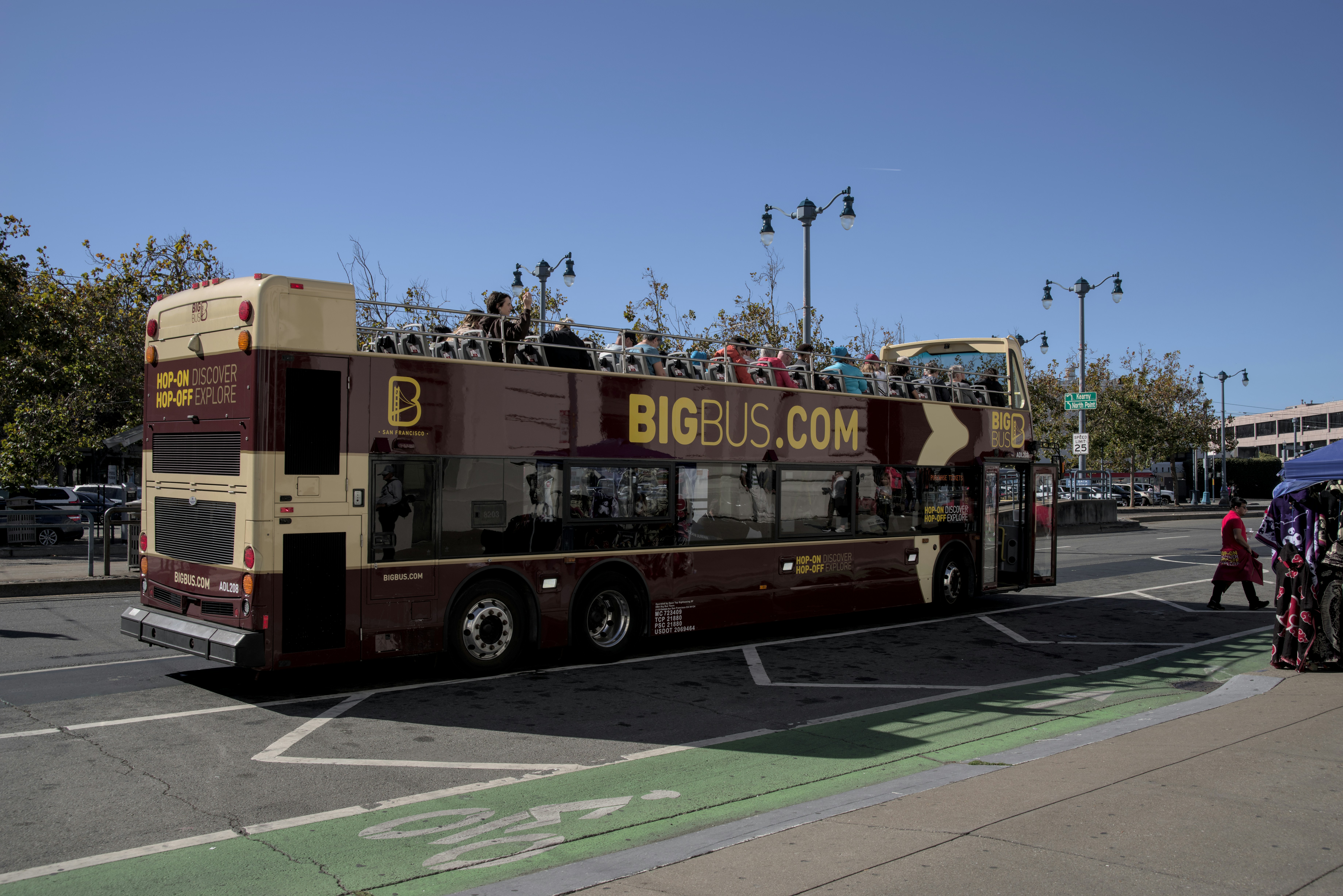 A double decker bus driving down a street