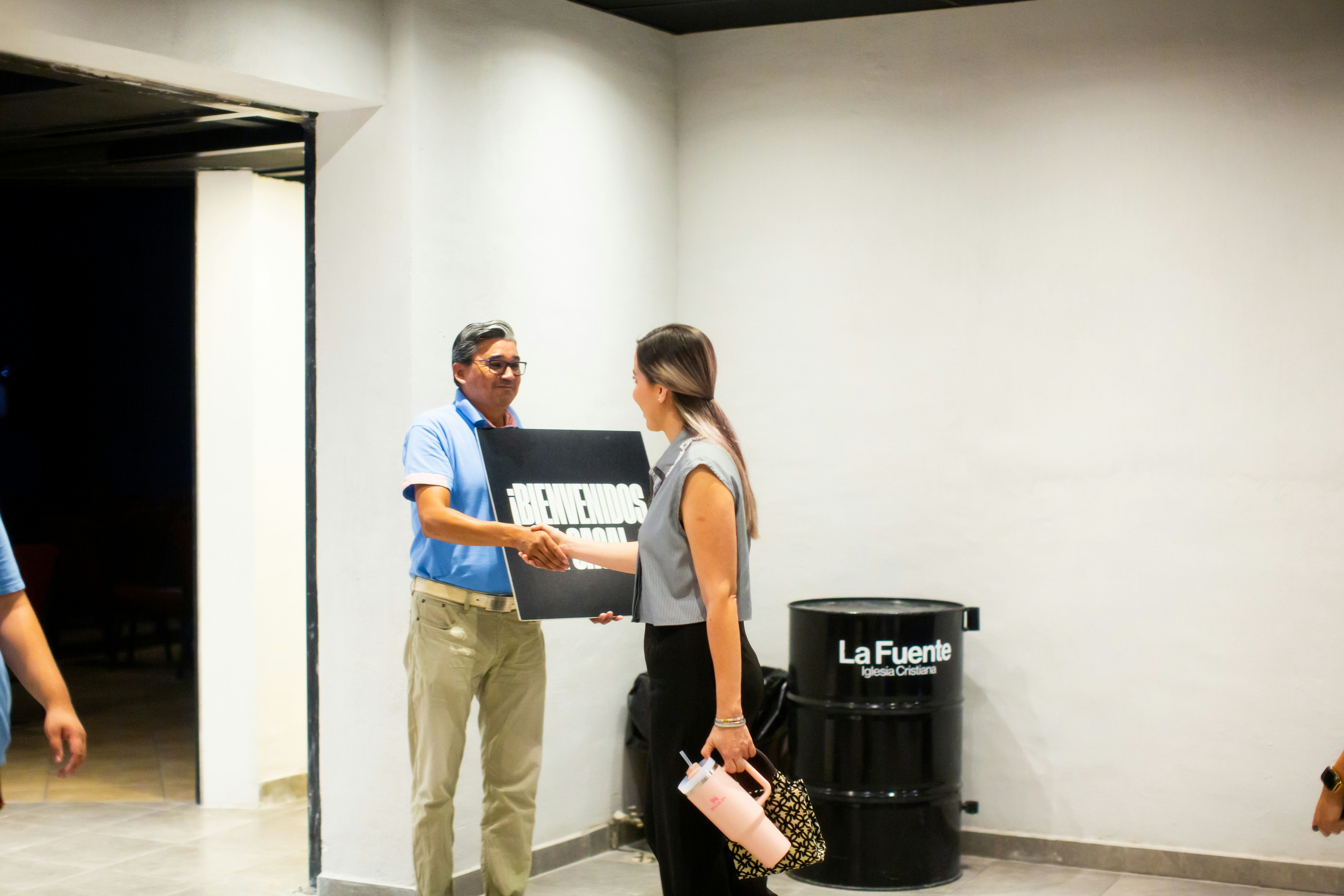 A man and a woman standing in a room