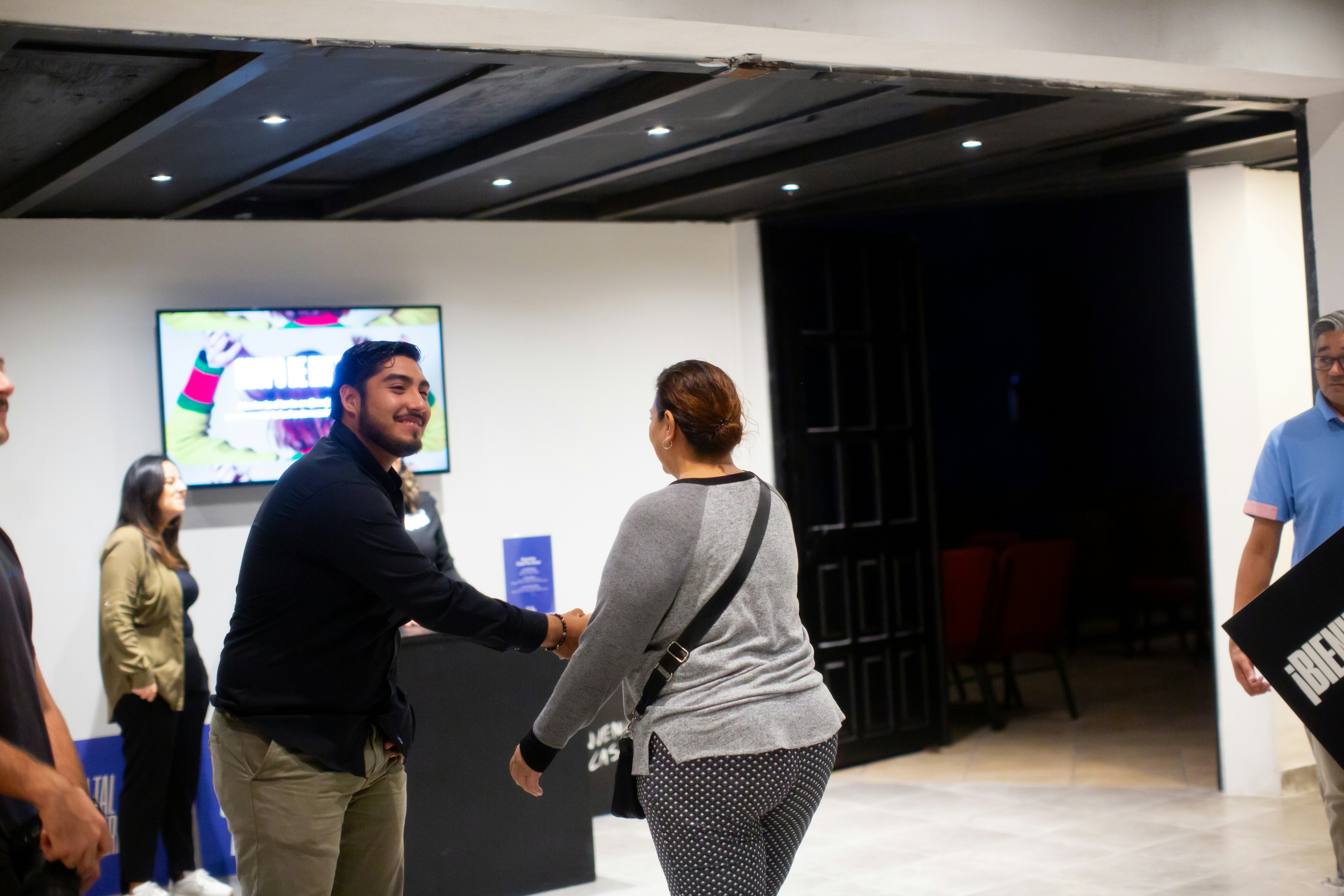 A group of people standing in a room