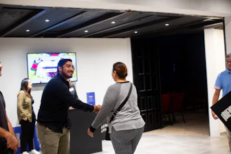 A group of people standing in a room