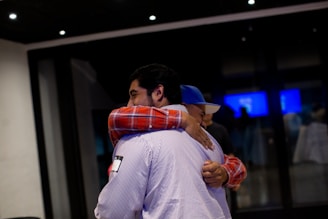 A couple of men standing next to each other