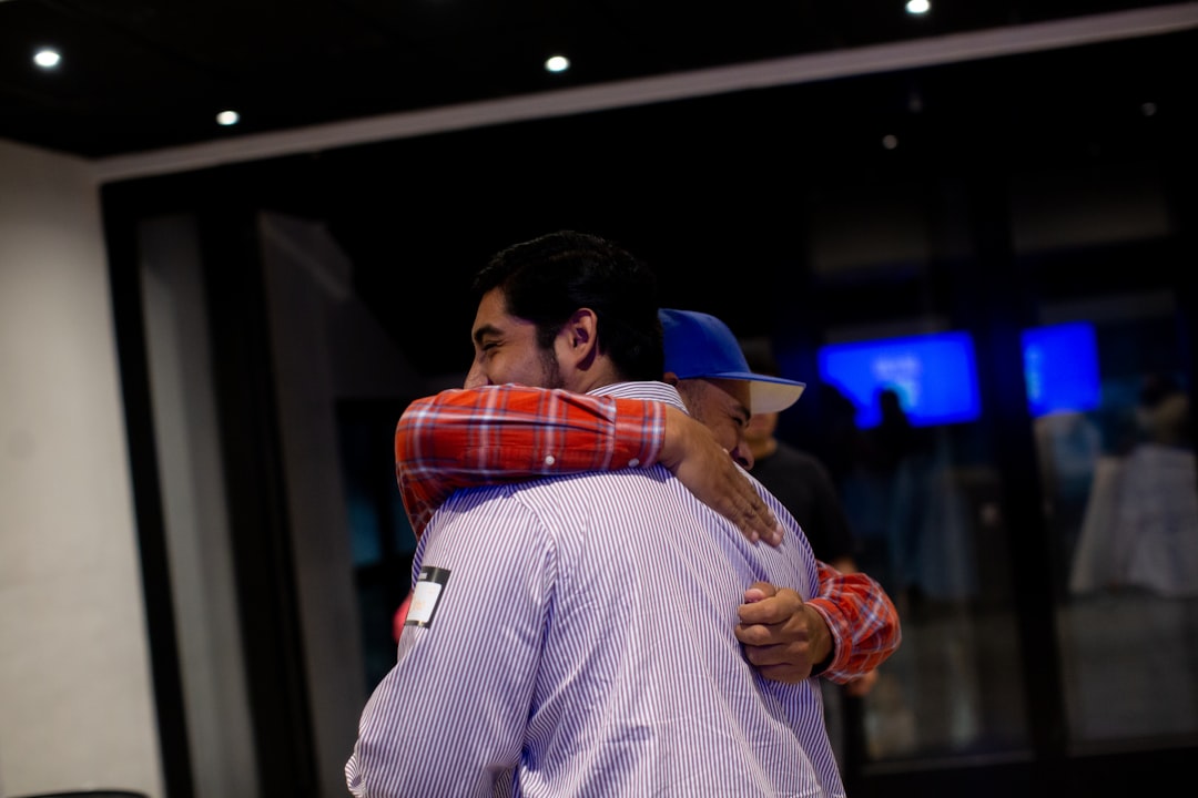 family embracing at airport international treatment reunion homecoming