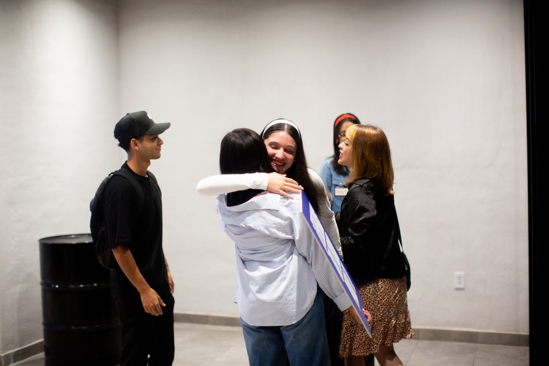 picture of a support group and two people hugging each other