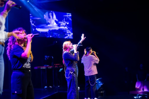 A group of people standing on top of a stage