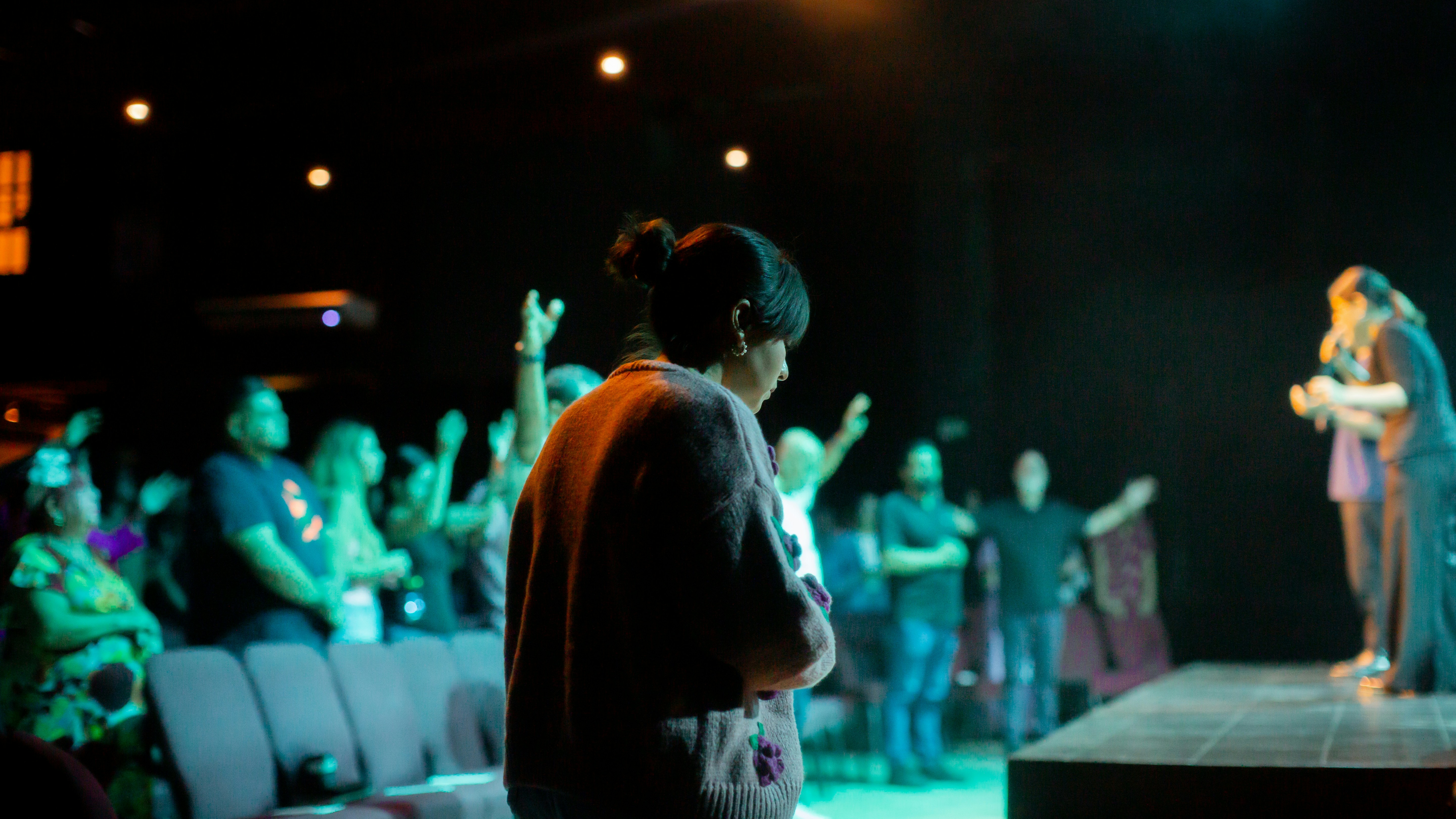 A group of people standing on top of a stage