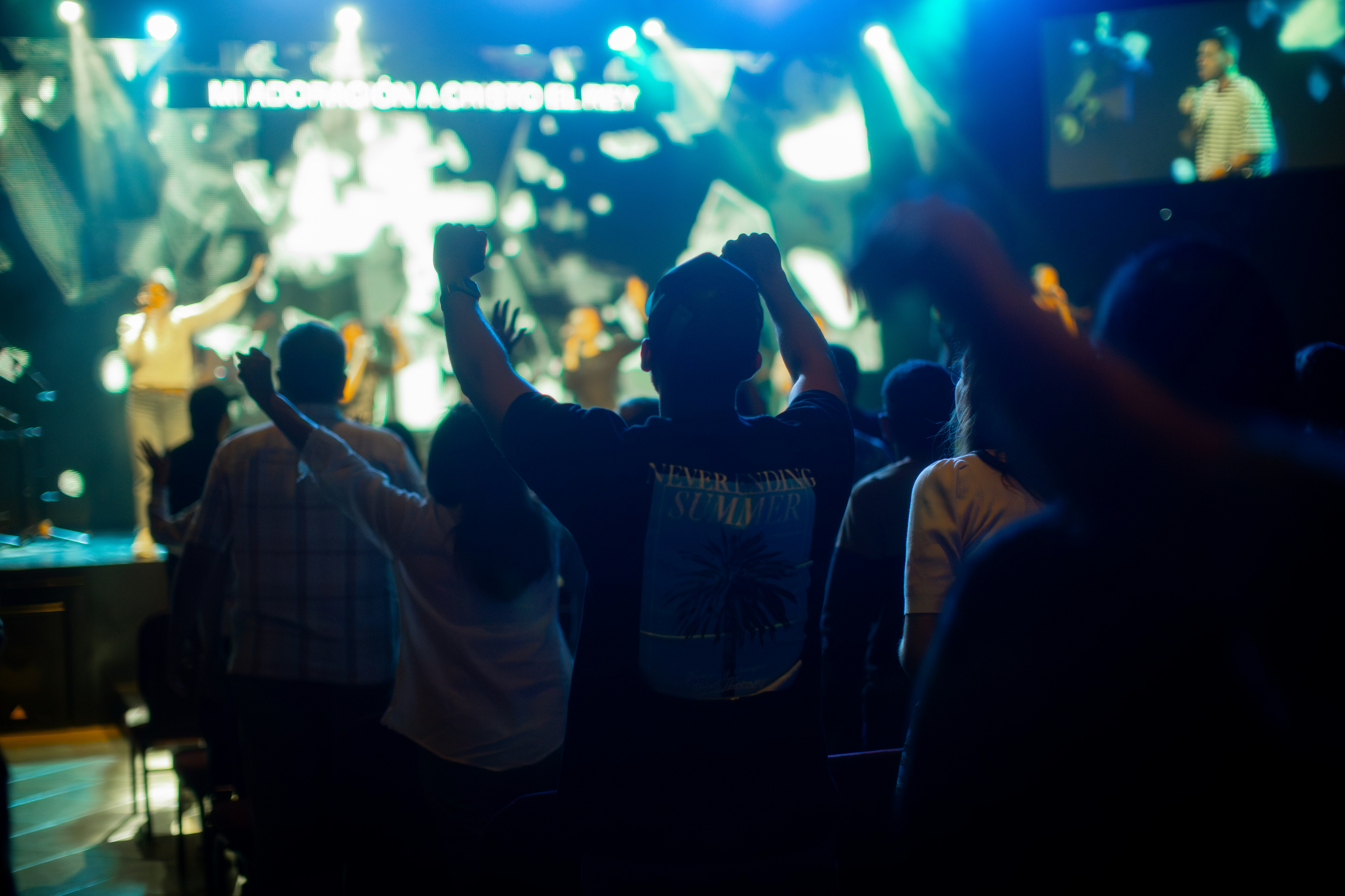 A group of people standing in front of a stage