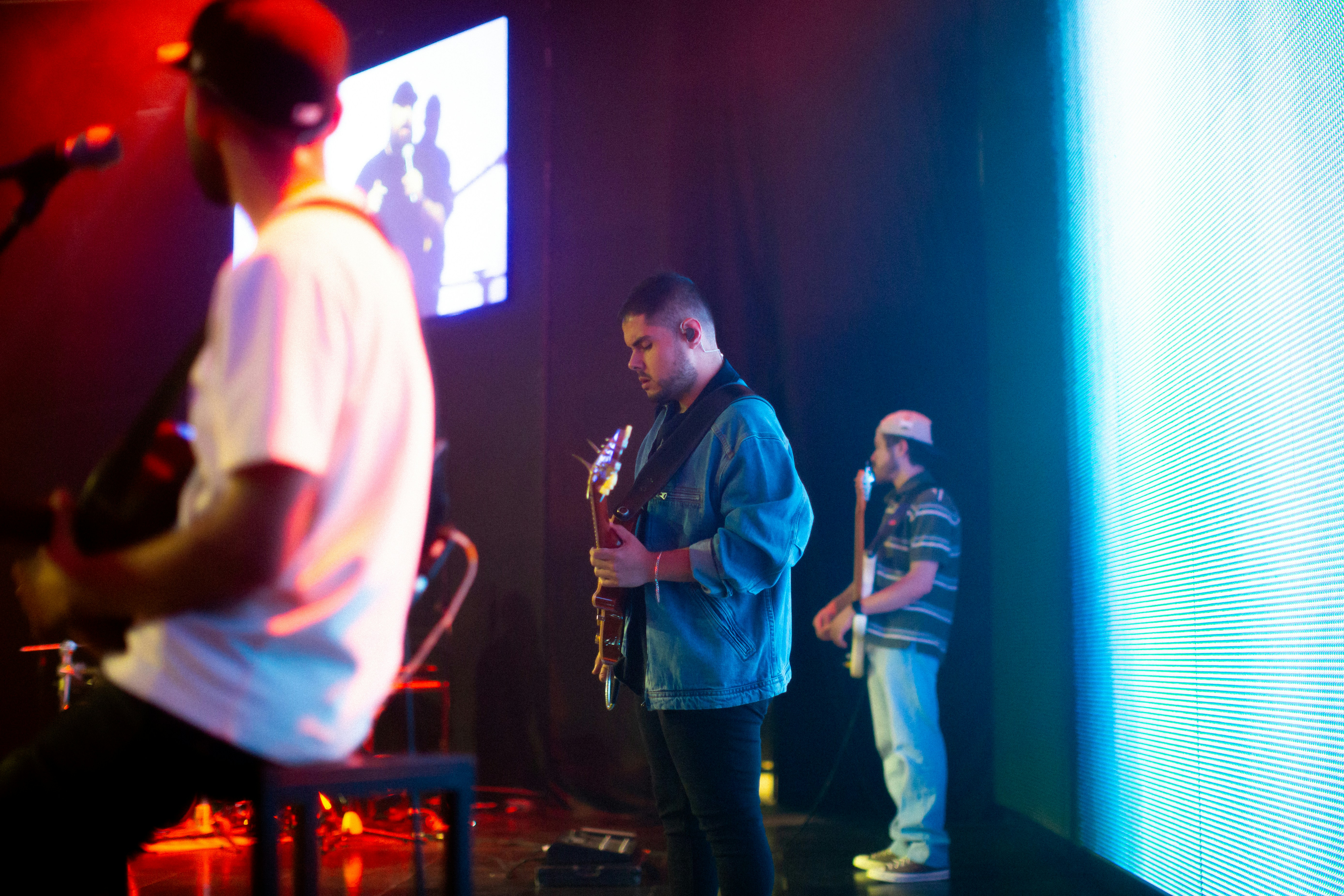 A group of men standing on top of a stage