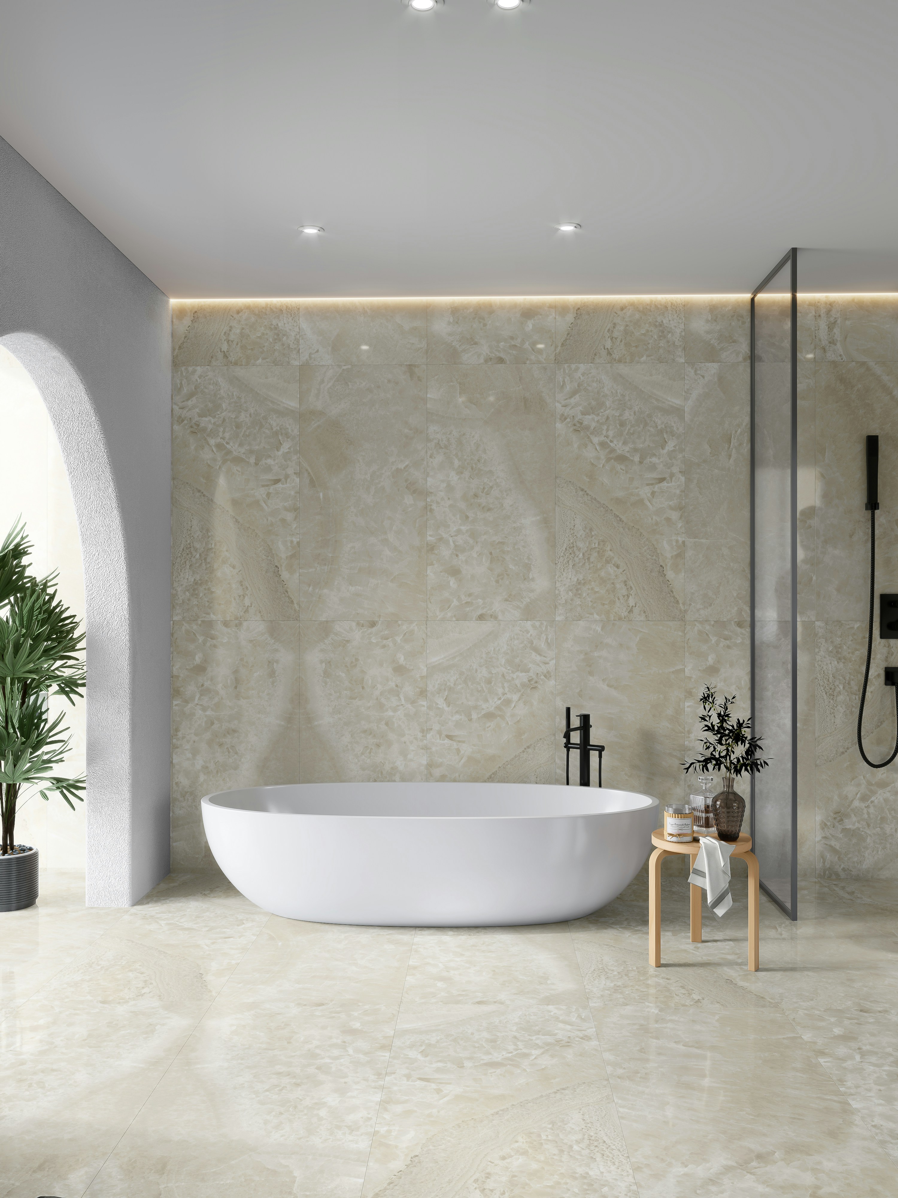 Elegant modern bathroom with marble tile, frameless shower and freestanding tub