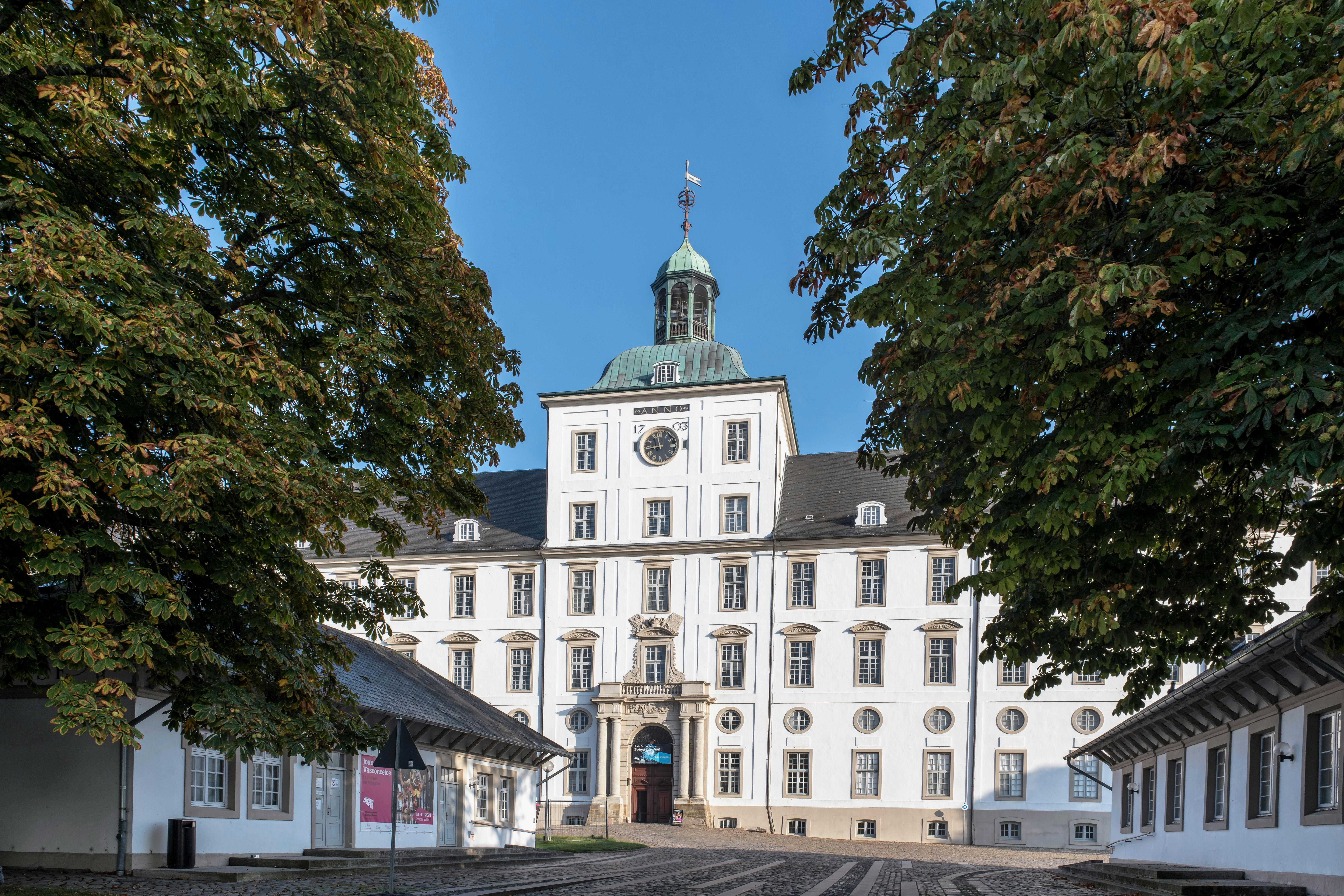 A large white building with a clock tower