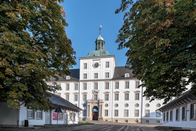 A large white building with a clock tower