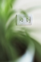 A close up of a light switch on a wall