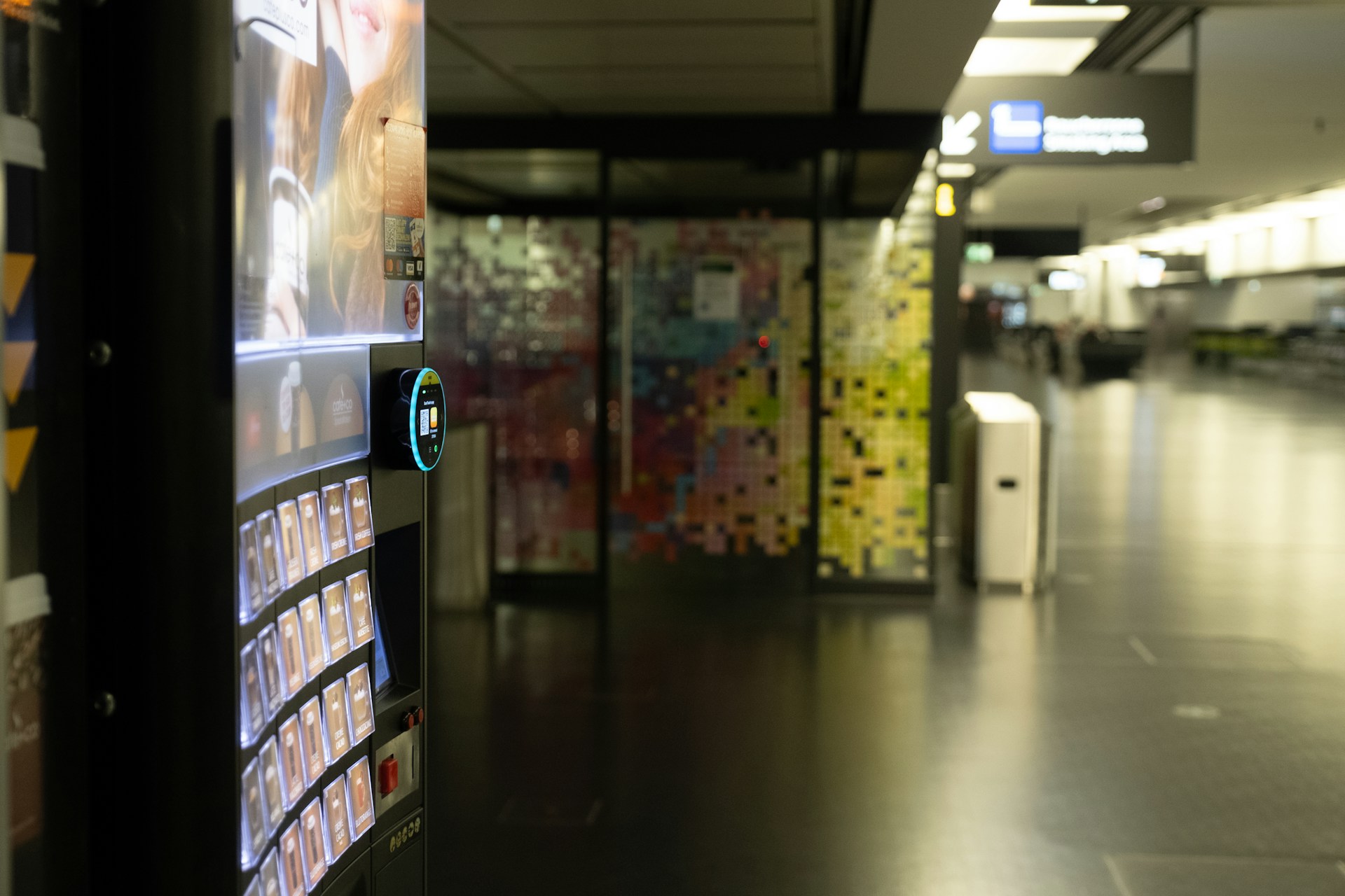 A hallway with a bunch of posters on the wall
