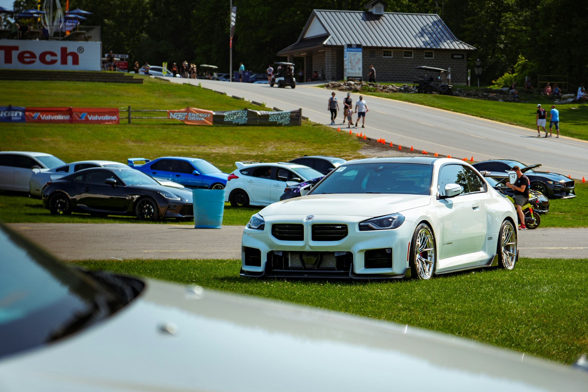 A bunch of cars parked on the side of a road