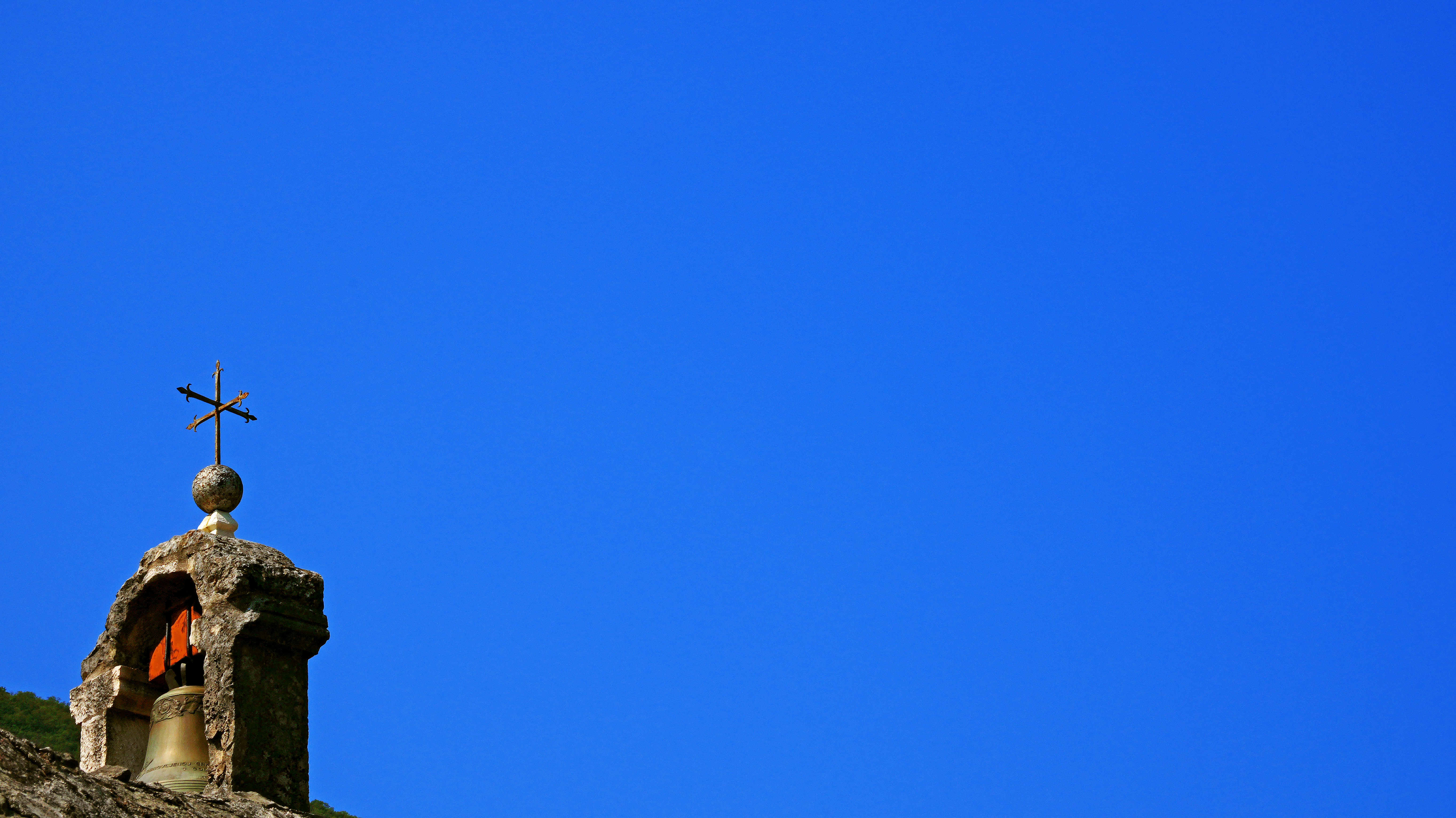 A church steeple with a cross on top