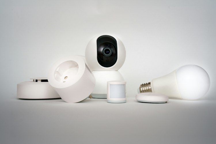 Minimalist living room with a smart speaker and connected light fixtures visible on a side table