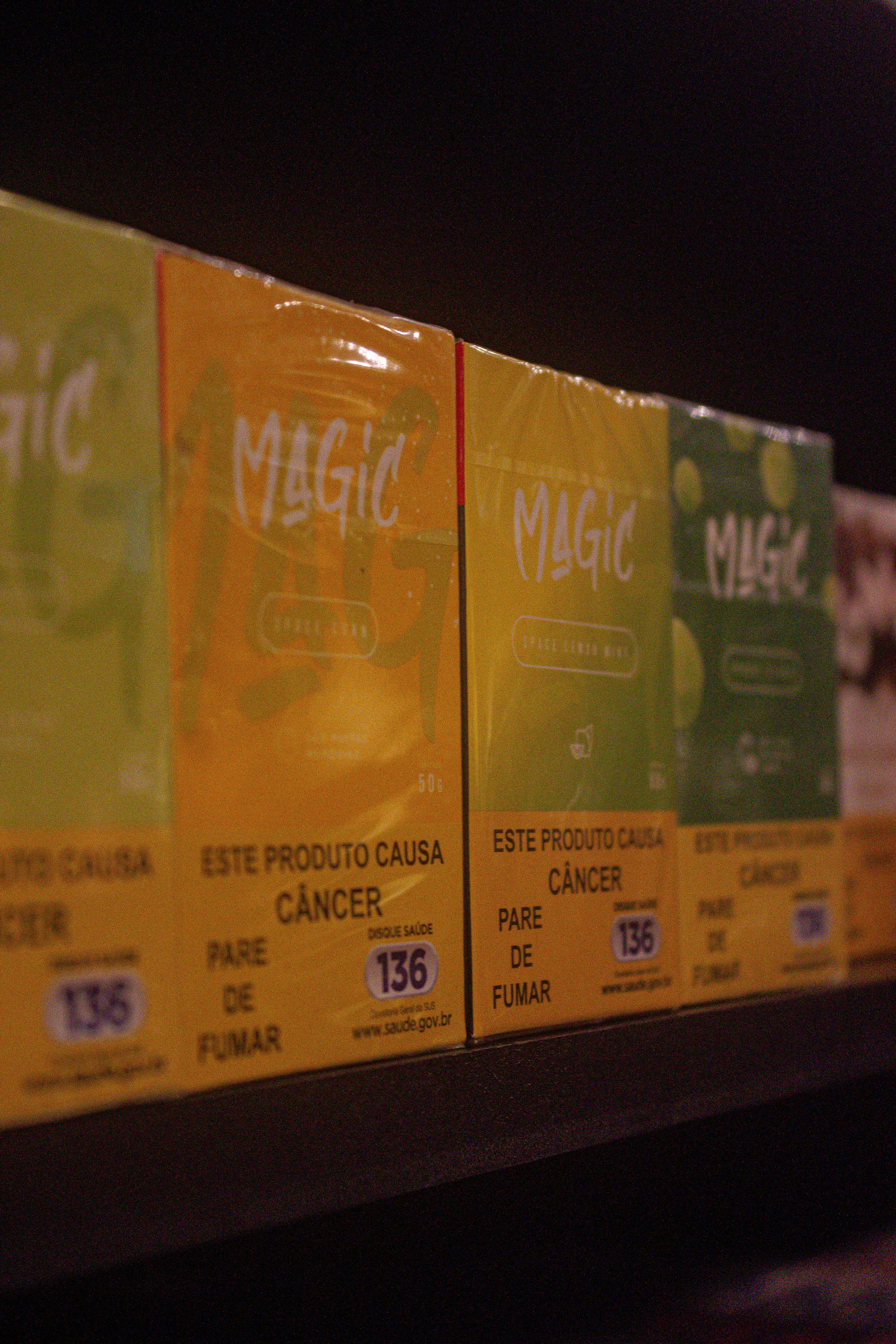 A row of boxes of magic tea on a shelf