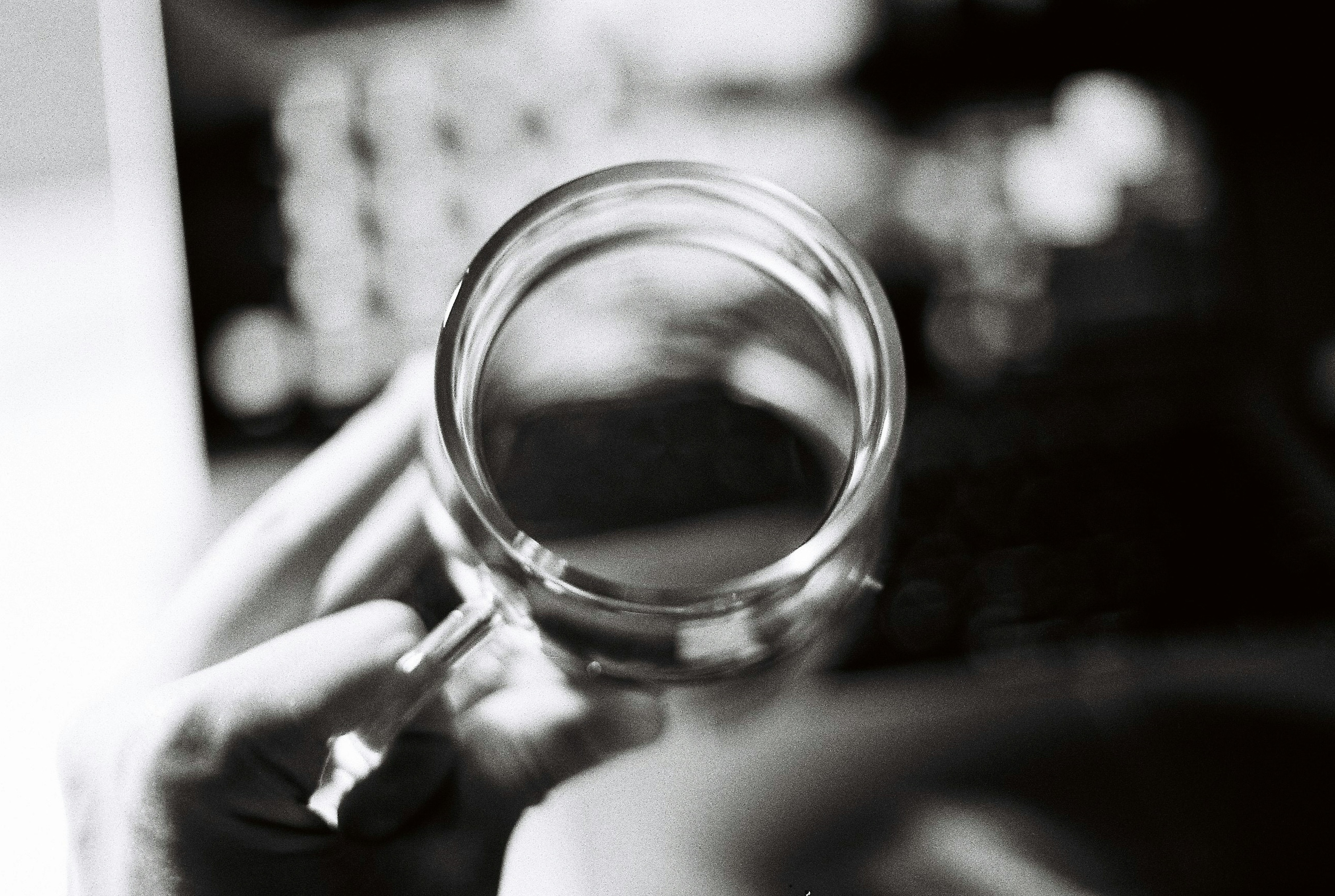 magnifying glass on policy document - home insurance policy comparison