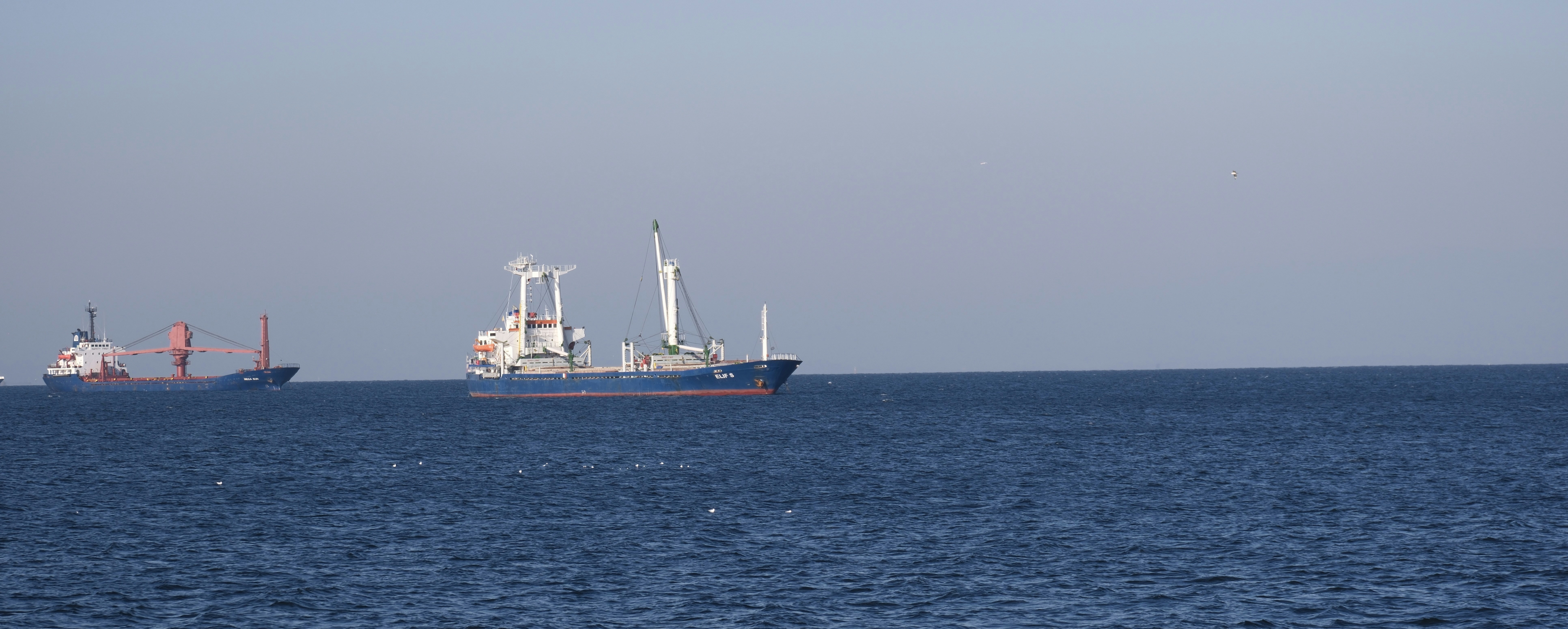 A large boat floating on top of a large body of water