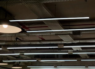 A group of lights hanging from the ceiling of a building